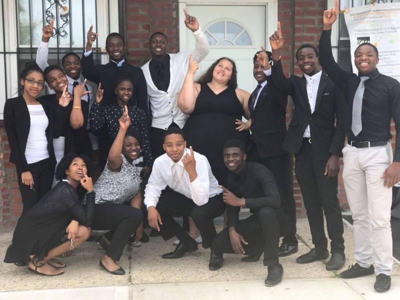 Apostle and some of the youths posing for pictures